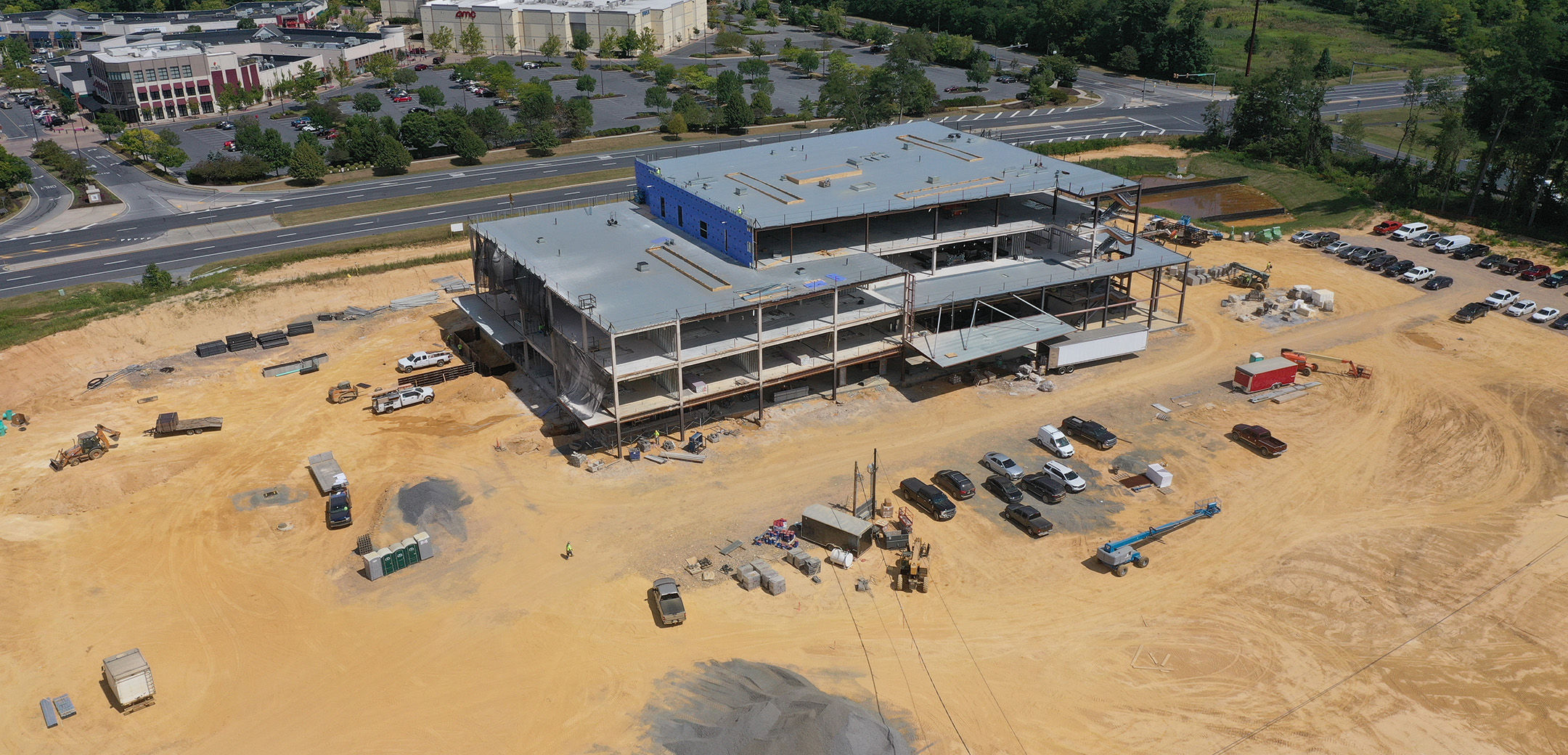 An aerial view of an active construction site of a large building