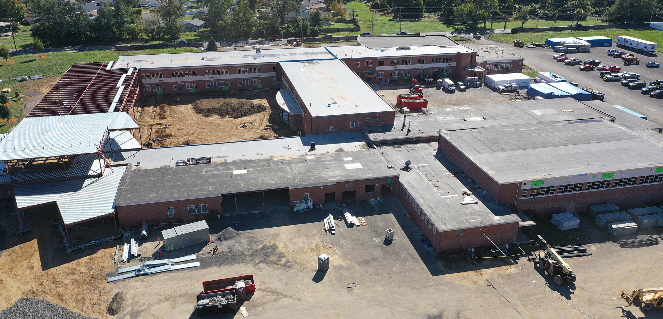 A drone aerial image of the Ben Franklin Middle School back side and parking lot during the construction.