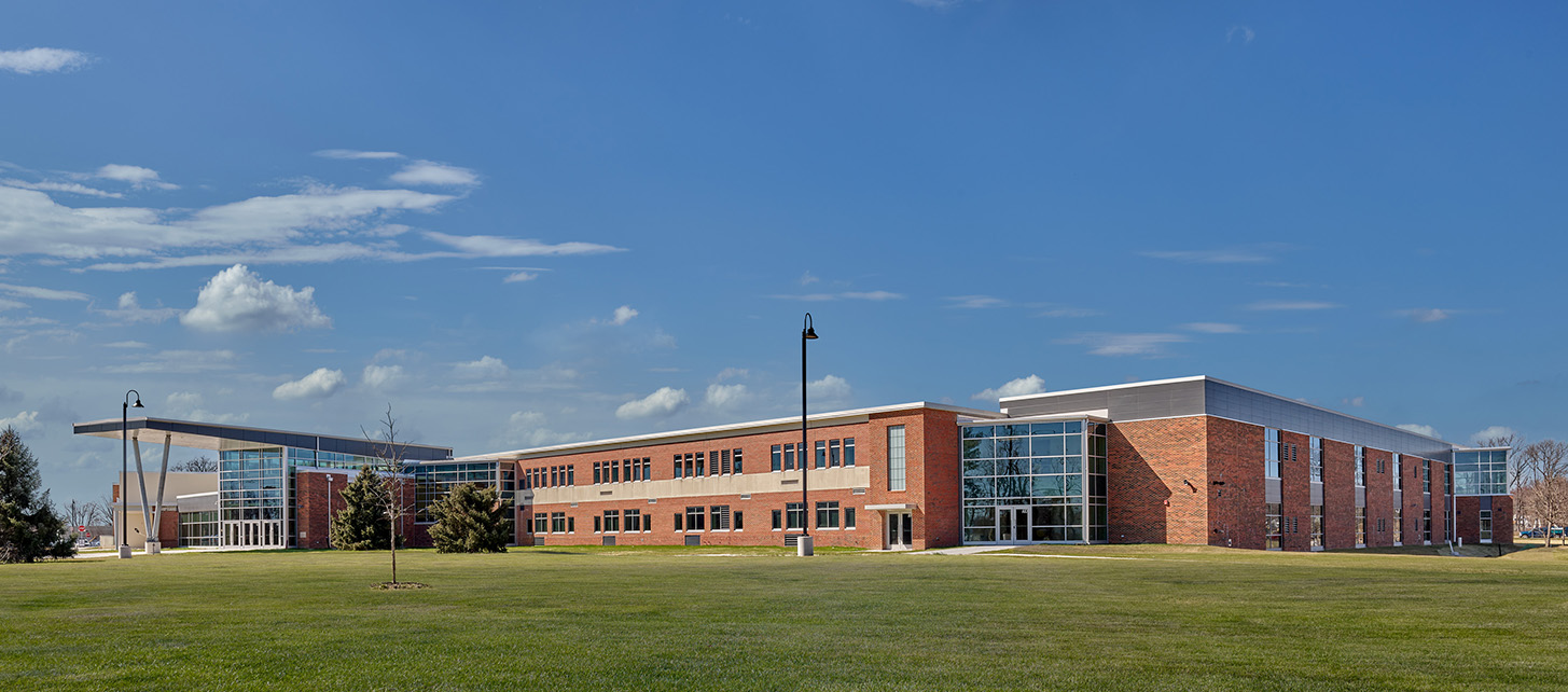 The exterior of Ben Franklin Middle School featuring a long building with a brick facade