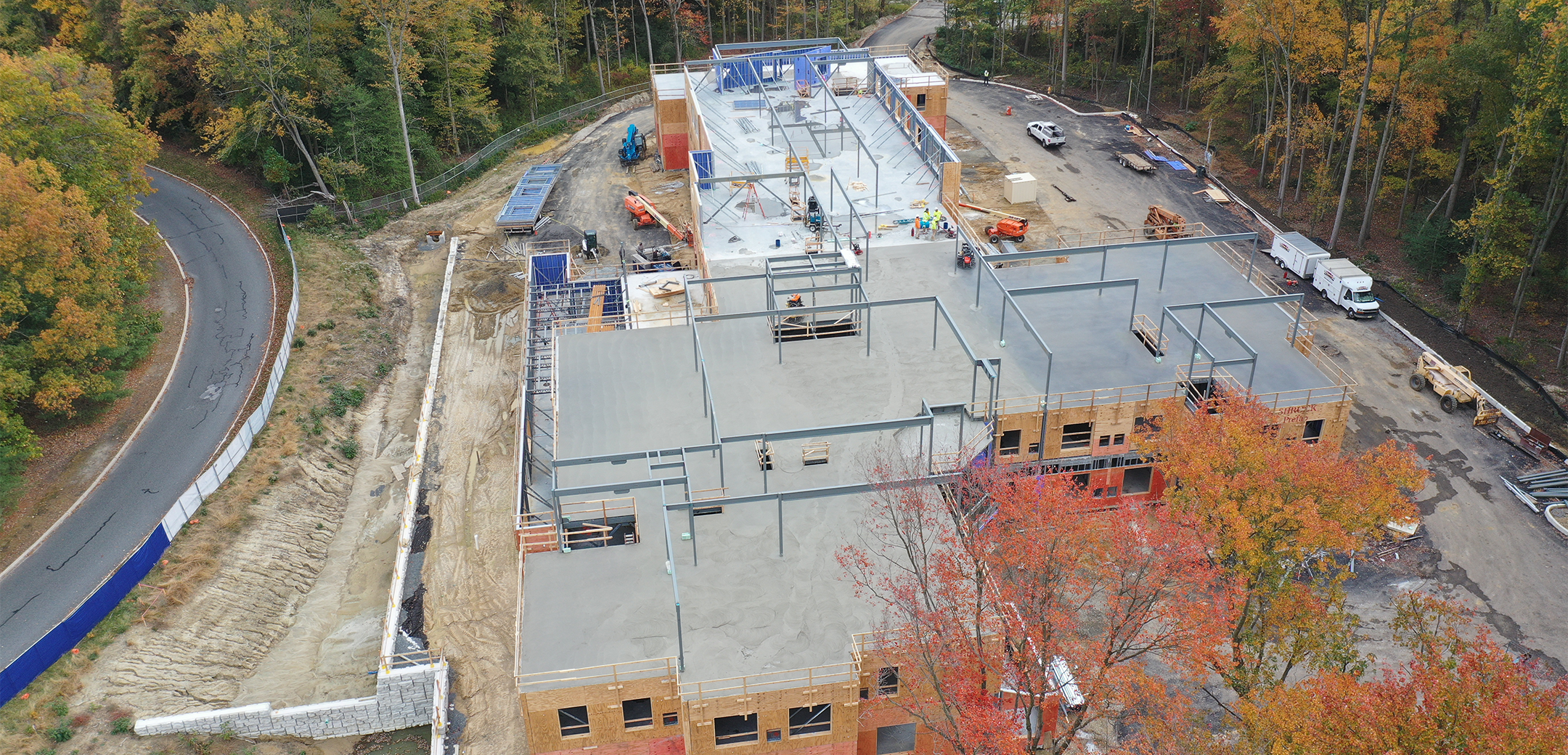 An aerial view of the Arbor Terrace Marlton construction process showcasing the brick walls, and framework of the second floor.