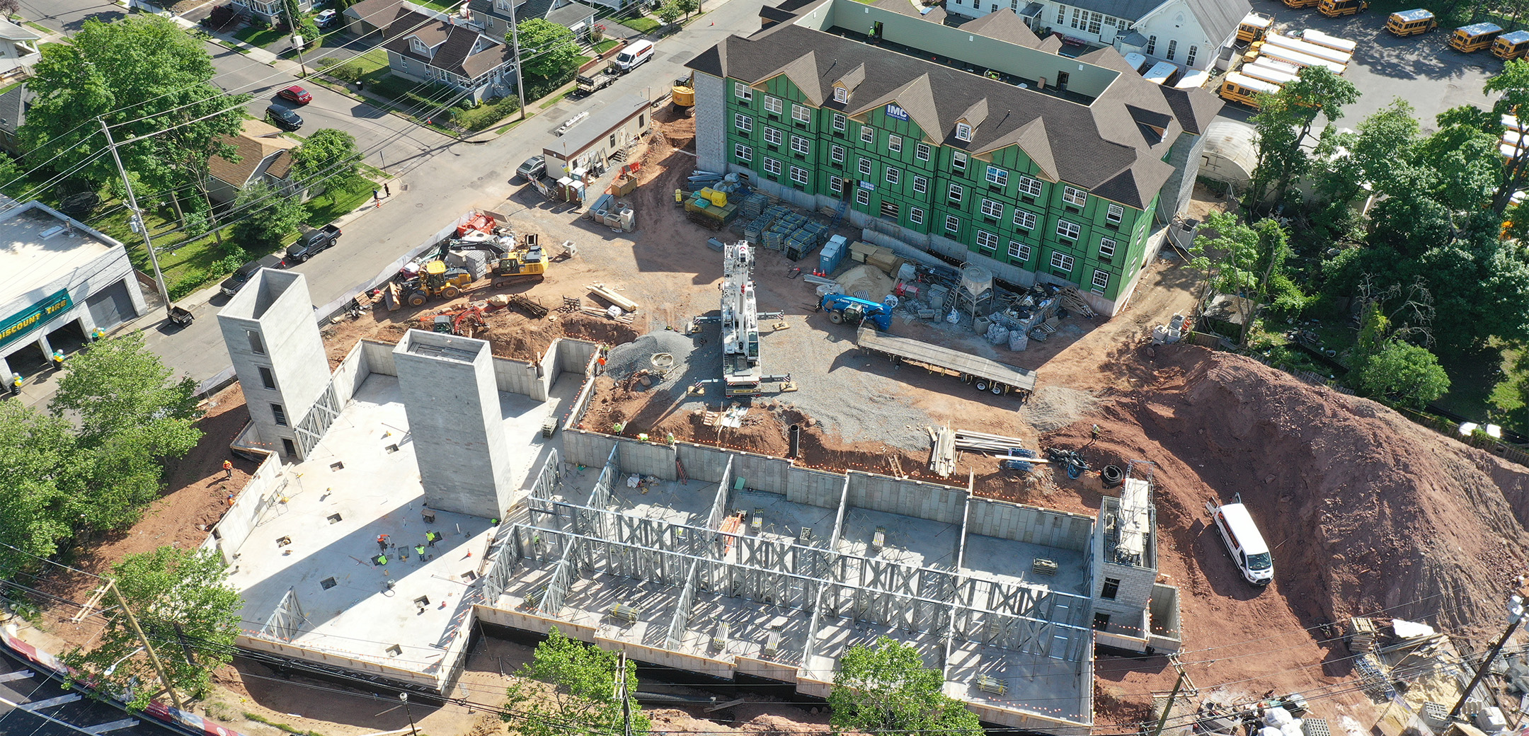 The aerial view of the two Chelsea senior living buildings under construction.