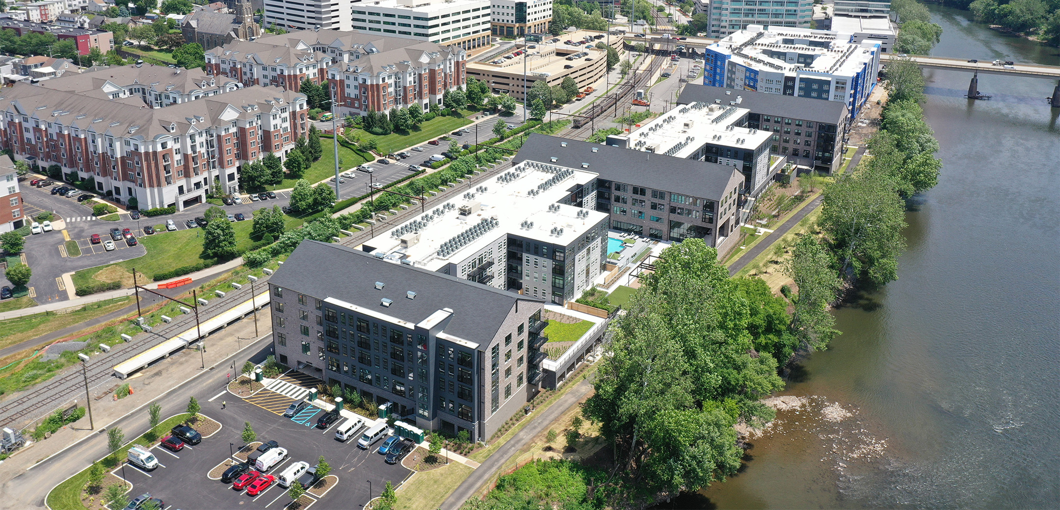 An aerial view of Matson Mill in Conshohocken, PA with the Schuylkill river and town on either side