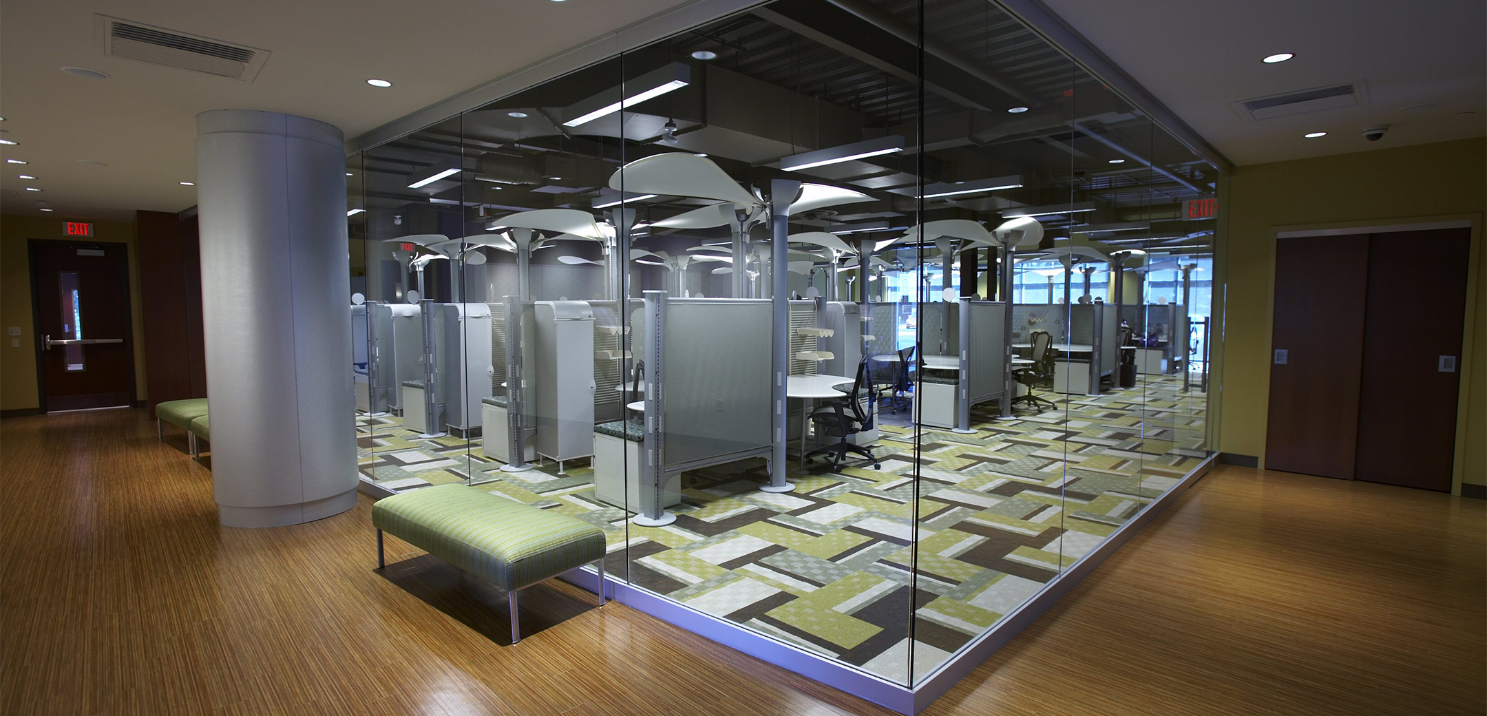 An interior hallway photo of the South Jersey Federal Union building featuring polished wood flooring, all glass walls showcasing the office space.