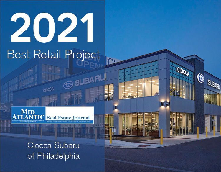 An awards graphic featuring the 2021 Best Retail Project, Marej logo placed on a half blue tinted image of Ciocca Subaru of Philadelphia.