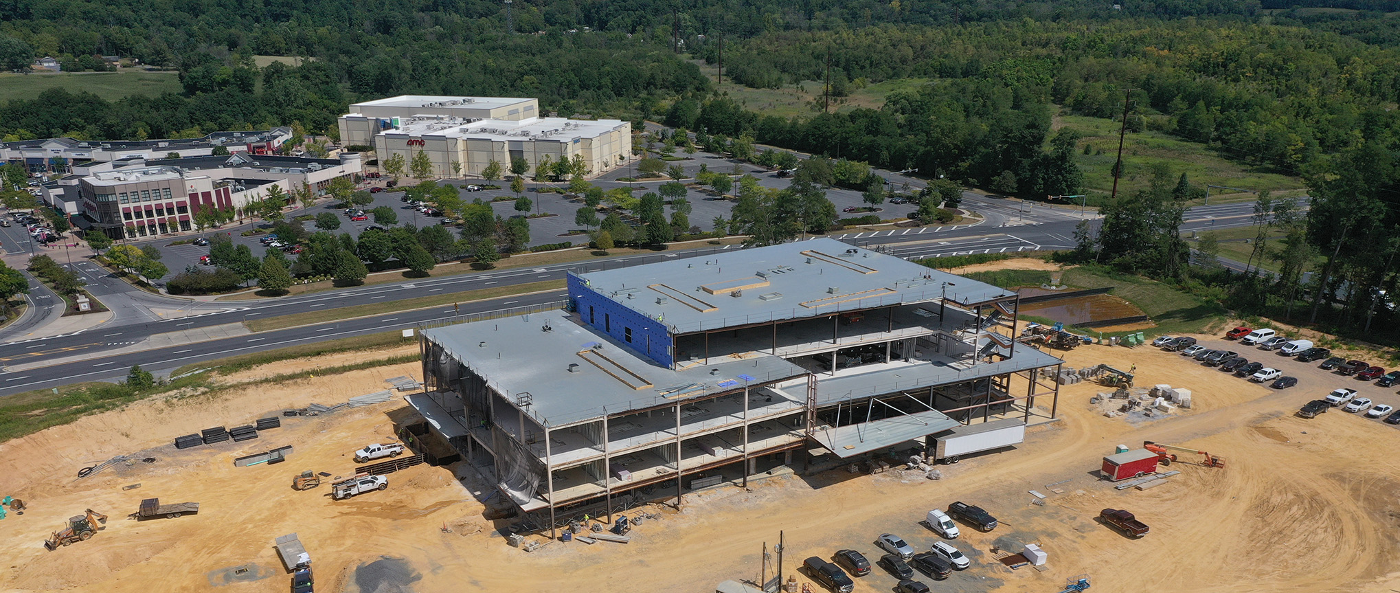 An aerial view of Good Shepherd Rehabilitation Hospital under construction featuring the exterior metal framing of the building