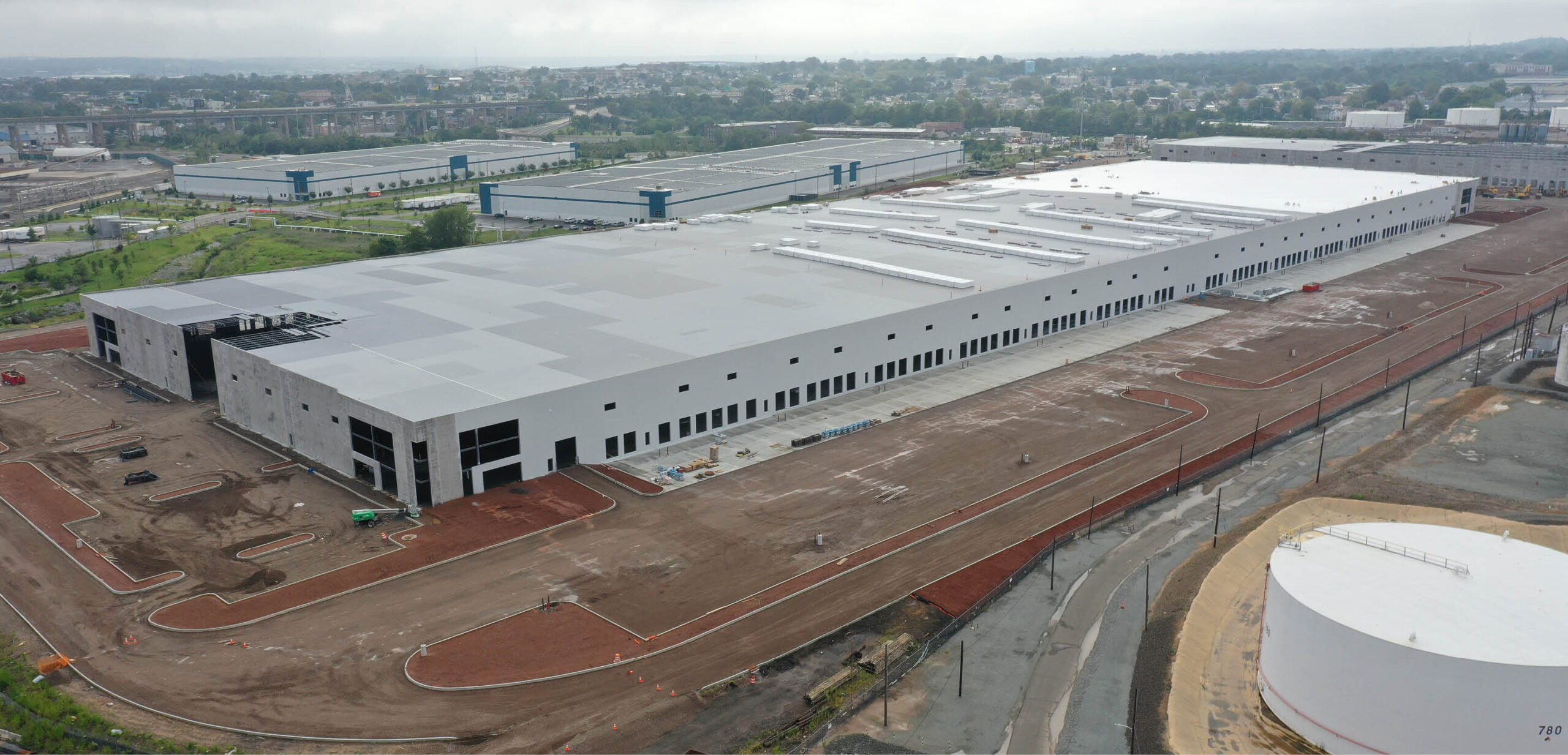 Large warehouse being built with roofing work